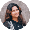 Customer decorating mini cakes during a baking session at Cake Influenza, sharing their positive experience.