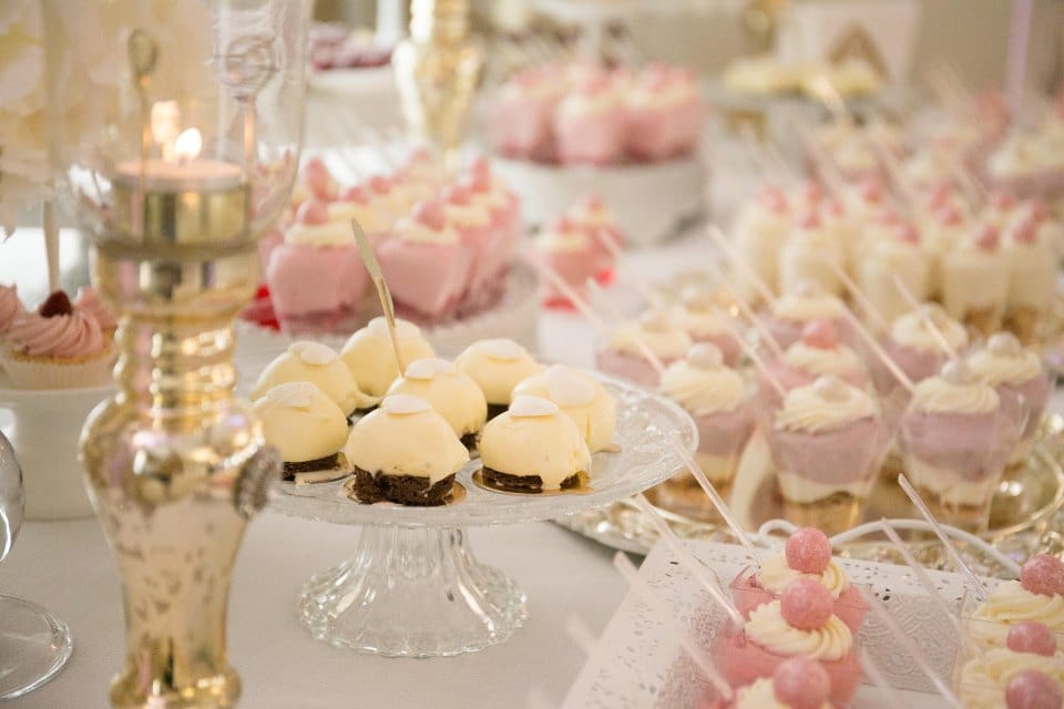 Elegant dessert table with mini cakes, mousse cups, and handcrafted sweets from Cake Influenza bakery in Dumdum